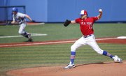 Kansas starter Wes Benjamin delivers as Air Force runner Brian Sicher takes off for home on a squeeze bunt play in the fourth inning, Saturday, May 5, 2012, at Hoglund Ballpark.