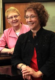 Rogene Anderson, left, and Cathy Crispino, longtime music teachers at Lawrence High School, are retiring at the end of the school year. Crispino has been the choir director for the last 15 years, and Anderson has been the choir's accompanist for the last 23 years.