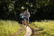Justin Henning, Lawrence, leads a group of Lawrence Trailhawks runners along the North River Trail on Monday, May 7, 2012.