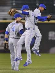 Kansas City outfielders Jarrod Dyson, left, Jeff Francoeur, center, and Alex Gordon celebrate after defeating Chicago. The Royals blanked the White Sox, 5-0, Saturday in Chicago.