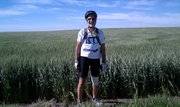 Former Lawrence mayor John Nalbandian stands next to a field en route to Colby during his previous trip with Biking Across Kansas in 2010. He plans to take part in the ride again this summer.