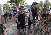 From left in foreground, friends Lexy Quandt, Council Bluffs, Iowa, and Lisa Rasor, Lawrence, wait with 300 other bicyclists for the start of the 36th annual three-day Cottonwood 200 ride May 26. Like many cyclists, Rasor and Quandt use the Cottonwood ride to prepare for the 8-day, 475-mile Biking Across Kansas, which they will participate in June 9-16.