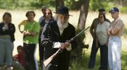 Abolitionist John Brown, played by Kerry Altenbernd, of Lawrence, walks away after giving a guided tour commemorating the 156th anniversary of the Battle of Black Jack at the Black Jack Battlefield Saturday, June 2, 2012 east of Baldwin City.