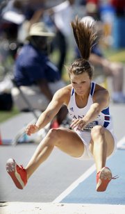 Kansas' Andrea Geubelle leaps to the pit during the women's triple jump at the NCAA outdoor track and field championships, Saturday, June 9, 2012, at Drake Stadium in Des Moines, Iowa.