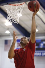 Freshman Perry Ellis puts in a layup as he works out for the campers during Bill Self's basketball camp on Monday, June 11, 2012, at the Horejsi Center.