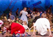 Dorothy, played by Carter Stacey, reacts as flying monkeys swoop down in the haunted forest during a Summer Youth Theater dress rehearsal of The Royal Shakespeare version of “The Wizard of Oz” at the Lawrence Arts Center.