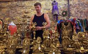 Kirk Webb, Lawrence, looks over the selection of items at Cosmos Indian Store, which opened in May at 734 Mass. in downtown Lawrence.