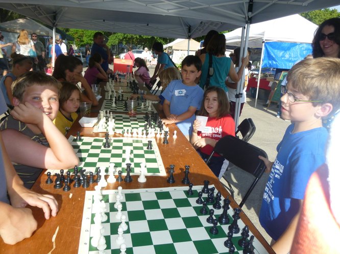 Students from more than to 10 area schools play together at Cottin's Hardware Farmers Market thanks to the Cordley Elementary School Chess Club and their parents!