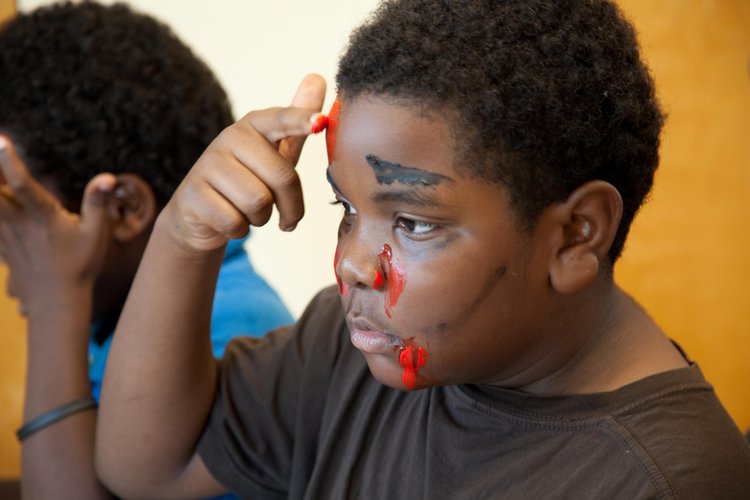 Participants learned how to apply zombie makeup before the 1.5 mile walk/bike/run.