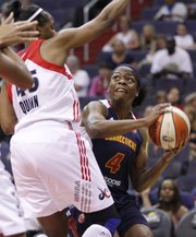 Connecticut Sun guard Danielle McCray goes up for a shot against a Washington Mystics defender, June 29, 2012, in Washington. McCray, a former Kansas University standout in her third year in the WNBA, is looking to help the Sun build on its league-best record.