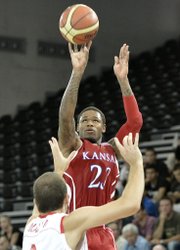 Kansas University's Ben McLemore shoots over Switzerland's Dusan Mladjan in Fribourg, Switzerland, Tuesday, Aug. 7, 2012.