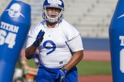 Kansas defensive lineman Jordan Tavai works against a practice dummy during defensive drills at the Fan Appreciation Day open practice Saturday, Aug. 11, 2012, at Memorial Stadium.