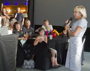 Maura Weis, wife of KU football coach Charlie Weis, right, speaks to a group in Topeka Friday, August, 17, 2012. Weis spoke on behalf of the Weis' nonprofit organization, Hannah & Friends, which benefits people with special needs. She was speaking at a TOP Soccer event for young soccer players with special needs.