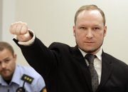 Mass murderer Anders Behring Breivik, makes a salute after he arrives at the court room in a courthouse in Oslo Friday Aug. 24, 2012 . Breivik has been declared sane and sentenced to prison for bomb and gun attacks that killed 77 people last year.