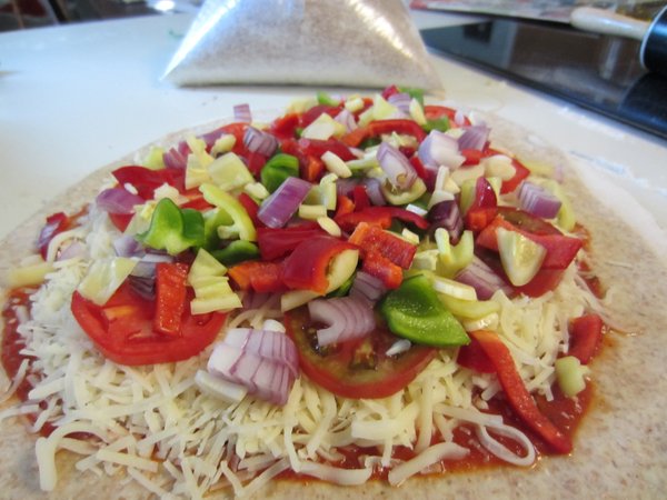 Pizza made with CSA peppers, homegrown tomatoes and local wheat flour.