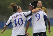 Kansas' Caroline Kastor (10) gives teammate Ashley Williams a pat on the back after Williams scored the first goal for KU against Creighton on Friday, Aug. 31, 2012, at Jayhawk Soccer Complex.