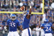Kansas defensive lineman Josh Williams raises his arms after recovering a fumble by South Dakota State in the second quarter, Saturday, September 1, 2012 at Memorial Stadium.