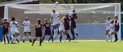 Kansas forward Jamie Fletcher (11) heads the ball as she helps defend the goal against an Arizona State corner kick during their soccer match Sunday, Sept. 2, 2012, at the Jayhawk Soccer Complex.