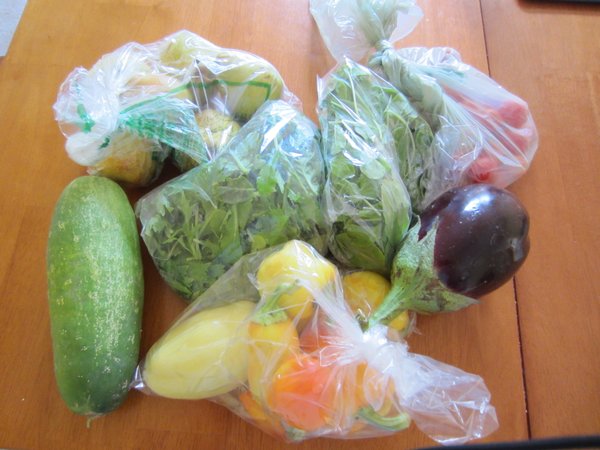 This week's goodies: pears, cucumber, peppers, arugula, spring mix, cherry tomatoes and eggplant.