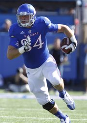 Kansas tight end Mike Ragone heads up the sideline after pulling in a second-quarter catch on Saturday, Sept. 8, 2012 at Memorial Stadium.