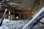 A Libyan man walks in the rubble of the damaged U.S. consulate, after an attack that killed four Americans, including Ambassador Chris Stevens on the night of Tuesday, Sept. 11, 2012, in Benghazi, Libya, Thursday, Sept. 13, 2012. The American ambassador to Libya and three other Americans were killed when a mob of protesters and gunmen overwhelmed the U.S. Consulate in Benghazi, setting fire to it in outrage over a film that ridicules Islam's Prophet Muhammad. Ambassador Chris Stevens, 52, died as he and a group of embassy employees went to the consulate to try to evacuate staff as a crowd of hundreds attacked the consulate Tuesday evening, many of them firing machine-guns and rocket-propelled grenades.