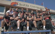 Baker University football team members from Lawrence schools, front row, from left, Dominick Reiske (LHS), Justin McCandless (FSHS), Ryder Wertz (FSHS), Ben Seybert (LHS), Cale Nieder (FSHS) and Aundre Allen (FSHS); and back row from left, trainer Colter Scott (FSHS), Matt Cole (FSHS), Dylan Perry (FSHS), Conner Stremel (FSHS), Jack Caywood (FSHS), coach Jason Thoren (LHS), Jake Green (LHS), and Preston Schenck (FSHS).