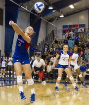 Kansas University's Brianne Riley (3) makes a play on the ball while teammates Morgan Boub (6) and Tiana Dockery (7) watch during the Jayhawks' volleyball match against No. 19 Iowa State on Wednesday, Sept. 26, 2012 at Horejsi Center.