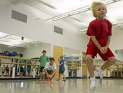 Eight-year-old Christopher Howard, Lawrence, leaps across the floor during an Athletic Movement class Sept. 14 at the Lawrence Arts Center, 940 N.H.