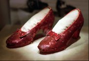 In this April 10, 1996 file photo, the ruby slippers worn by Judy Garland in the 1939 film "The Wizard of Oz" are shown on display during a media tour of the "America&squot;s Smithsonian" exhibition in Kansas City, Mo. The ruby slippers are leaving the U.S. on their first international journey to London&squot;s Victoria and Albert Museum.