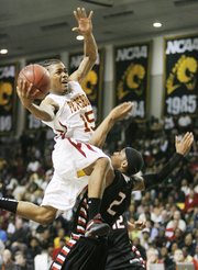 Petersburg guard Frank Mason (15) attempts a layup in this file photo from March 9 at the Siegel Center in Richmond, Va. Mason orally committed to Kansas University on Monday.