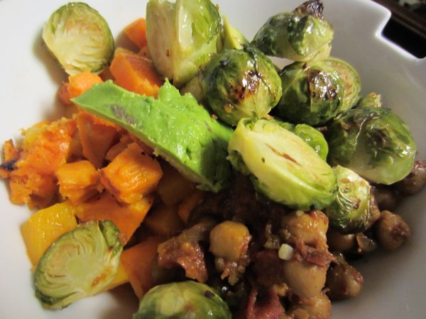 Roasted winter vegetables with salad greens and curried chickpeas.