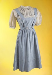 This undated publicity photo provided by Julien's Auctions shows the original costume worn by Judy Garland in the film "The Wizard of Oz." The dress will be on view at London's Safford Hotel Oct. 9-14, 2012, before being exhibited on Nov. 5 through 9, in Beverly Hills, Calif.