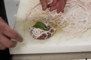 Michael Beard, executive chef at 715 restaurant, 715 Mass., prepares an appetizer of fegalo, an Italian-style liver sausage wrapped in caul fat.