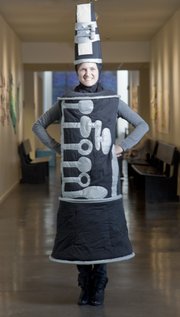 Whitney Boomer, a dancer and visiting artist at Lawrence Arts Center, models a clarinet costume designed by Jennifer Glenn, an acting instructor at the arts center who is also a freelance costume designer.