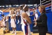 Kansas University coach Bonnie Henrickson, right, visits with senior forward Carolyn Davis as the KU women’s basketball team waits courtside during media day on Tuesday, Oct. 9, 2012, at Allen Fieldhouse. The Jayhawks, who are coming off a Sweet-16 appearance last season, hope to push for one of the top spots in the Big 12 this year.