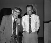 Author William Burroughs and Leonard Magruder stand in the lobby of Liberty Hall during River City Reunion week. Burroughs’ personal secretary, James Grauerholz, and poet Allen Ginsberg organized the event.