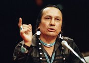 Russell Means, who headed the American Indian Movement, (AIM) testifies before a special investigative committee of the Senate Select Committee on Capitol Hill, in Washington in a Jan. 31, 1989 file photo. Means, a former American Indian Movement activist who helped lead the 1973 uprising at Wounded Knee, reveled in stirring up attention and appeared in several Hollywood films, died early Monday, Oct. 22, 2012, at his ranch Zzxin Porcupine, S.D., Oglala Sioux Tribe spokeswoman Donna Solomon said. He was 72.