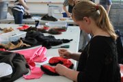 A student in the Style Rookies class at Lawrence Arts Center, 940 New Hampshire, sews an item for her wardrobe.