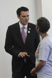 Congressman Kevin Yoder talks with Kansas University Libraries Dean Lorraine Haricombe on Wednesday at KU’s Watson Library.