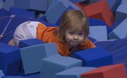 Rumbling through some sponge blocks, Alexandra Kaufman, 19 months, plays at Lawrence Gymnastics, 5150 Clinton Parkway, which allows parents and children to take a class together.