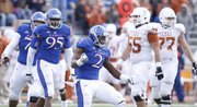 Kansas defensive end Darius Willis pumps his fist after sacking Texas quarterback David Ash during the third quarter on Saturday, Oct. 27, 2012 at Memorial Stadium.