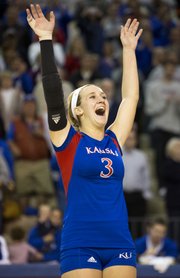 Kansas' Brianne Riley raises her hands in celebration following Kansas' victory over Big 12 conference foe West Virginia, Monday, Oct. 29, 2012 at the Horejsi Center. The Jayhawks defeated the Mountaineers 3-0 and improved their overall record to 20-4.