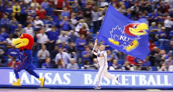 The Jayhawk and the KU flag lead the way out onto the court prior to tipoff against Emporia State, Tuesday, Oct. 30, 2012 at Allen Fieldhouse.