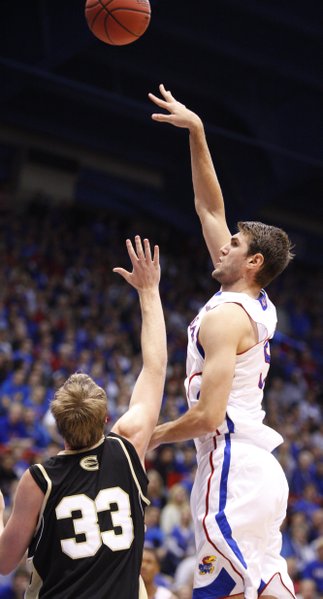Kansas center Jeff Withey hooks a shot over Emporia State forward Michael Harris during the first half, Tuesday, Oct. 30, 2012 at Allen Fieldhouse.