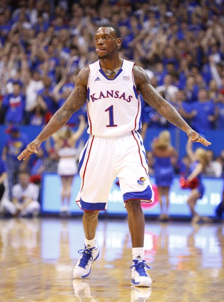 Kansas guard Naadir Tharpe signals "three" after hitting a three-pointer against Emporia State during the first half, Tuesday, Oct. 30, 2012 at Allen Fieldhouse.