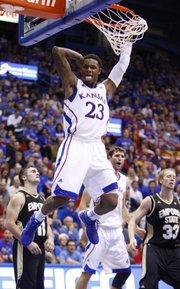 Kansas guard Ben McLemore flashes his tongue after a put-back dunk against Emporia State during the second half, Tuesday, Oct. 30, 2012 at Allen Fieldhouse.