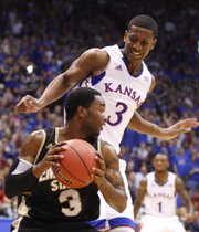 Kansas guard Andrew White defends as Emporia State guard Chris Sights looks to pass during the first half, Tuesday, Oct. 30, 2012 at Allen Fieldhouse.