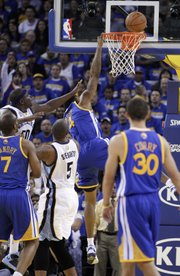 Memphis Grizzlies' Zach Randolph (50) makes contact with Golden State Warriors' Brandon Rush (4) during the first half of an NBA basketball game Friday, Nov. 2, 2012, in Oakland, Calif. Rush left the game with an injured knee after this play.