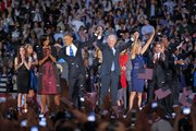 President Barack Obama and wife Michelle is holds hands with Vice President Joe Biden and his wife Jill following Obama's victory speech to supporters in Chicago early Wednesday, Nov. 7 2012.
