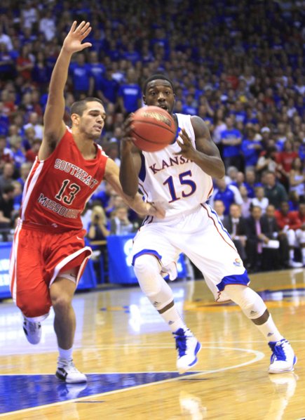 KU guard Elijah Johnson takes the ball against Southeast Missouri's Lucas Nutt during the first half Friday at Allen Fieldhouse.